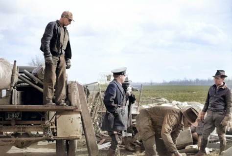 State highway official moving sharecroppers away from roadside to area between levee and Mississippi river