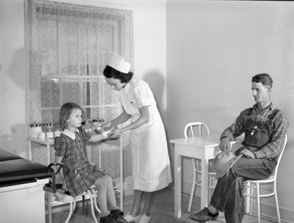 Patient receiving medical aid in health clinic