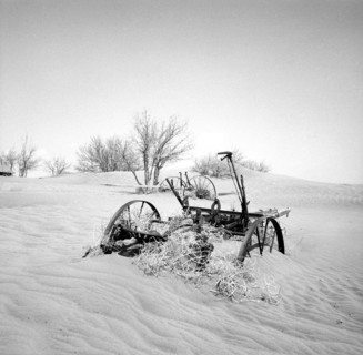 Buried farm equipment after dust storm