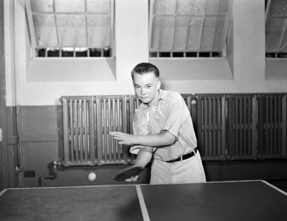 Boy playing ping pong