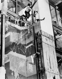 Two People jumping from building