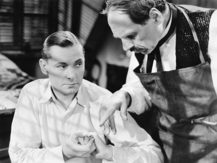 Herbert Marshall (left)