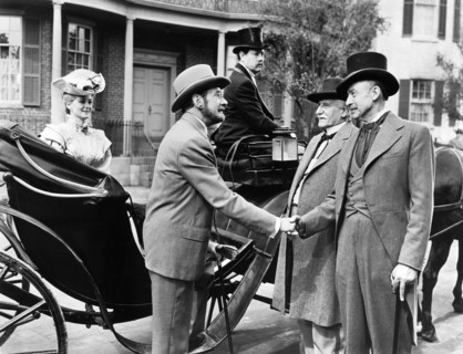 Clifton Webb (center)