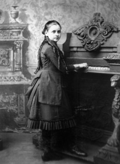 Young Girl playing Harmonium