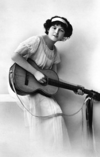 Young Adult Woman with Acoustic Guitar