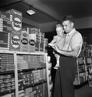 Father with infant son shopping