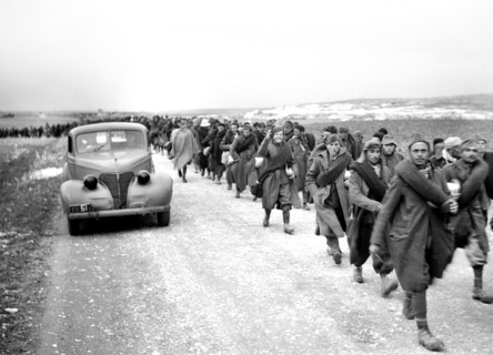 Italian prisoners of war walking along road after detraining at Wadi al-Sarar Railway Station