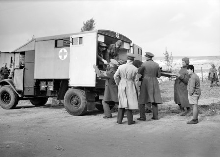 Italian prisoner of war on stretcher being  lifted into ambulance after detraining at Wadi al-Sarar Railway Station