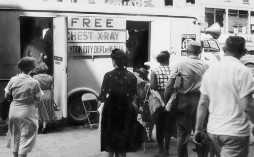 Group of men and women in line to enter free chest x-ray van operated by the New York City Department of Health
