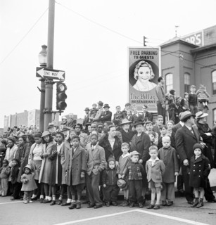 Crowd on street corner watching Armistice Day parade, Lancaster, Pennsylvania, USA, Marjory
