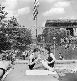 Two young women relaxing by community pool, Washington, D.C., USA, Marjory Collins, U.S. Office of