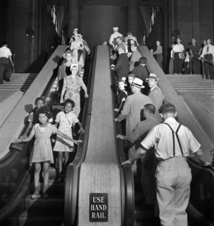 Group of people on escalators, Pennsylvania Station, New York City, New York, USA, Marjory Collins,