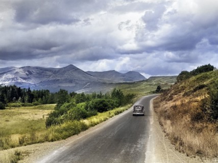 Car traveling on rural road through Glacier National Park, Montana, USA, Marion Post Wolcott, U.S.