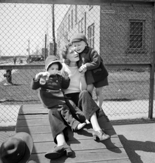 Mother with her two children at Lakeview nursery school for children of working mothers, operated