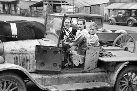 Farmer's children sitting in farm truck, Saturday afternoon, San Augustine, Texas, USA, Russell