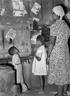 Wife of sharecropper teaching her children their ABC's, near Marshall, Texas, USA, Russell Lee, U.S