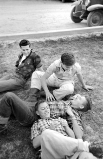 Group of young men relaxing on lawn, Imperial County Fair, El Centro, California, USA, Russell Lee,
