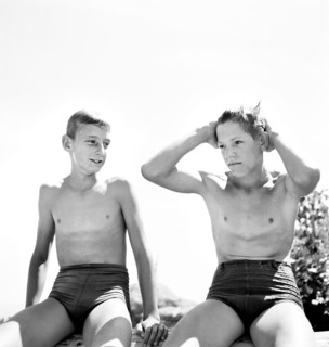 Two young teen boys in swimsuits relaxing after a swim, Rupert, Idaho, USA, Russell Lee, U.S. Farm