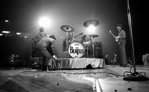 English rock and roll band The Beatles on stage during performance, Washington Coliseum,