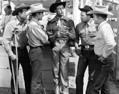 Casey Tibbs (2nd left), Scott Brady (center) on-set of the film, "Bronco Buster", Universal