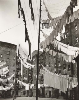 Courtyard of tenement buildings filled with lines of laundry, Yorkville, New York City, New York,