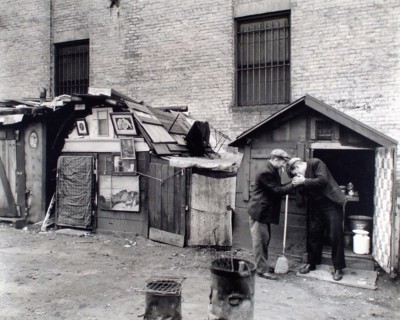 Two homeless men smoking cigarettes, unemployed and huts, West Houston and Mercer Streets, New York