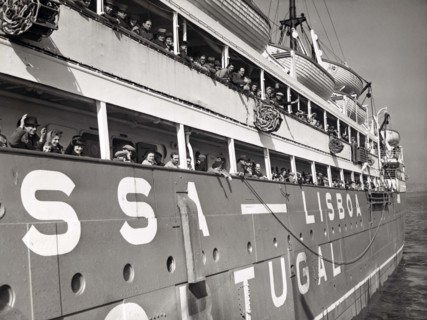 War refugees lining rails of Portuguese ship Nyassa while docked, New York City, New York, USA, New