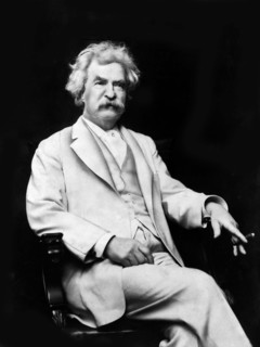 American Writer and Humorist Samuel Clemens, better known as Mark Twain, three-quarter length