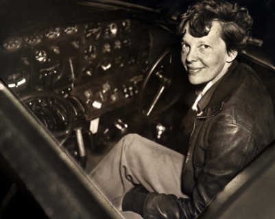 Amelia Earhart sitting in the cockpit of an Electra airplane, Acme Pictures, 1930's