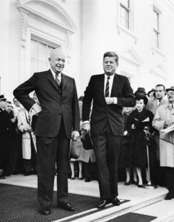 U.S. President Dwight Eisenhower and U.S. President-elect John Kennedy stand before reporters