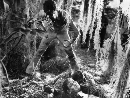 Sam Elliott (standing), on-set of the film, "Frogs", American International Pictures, 1972