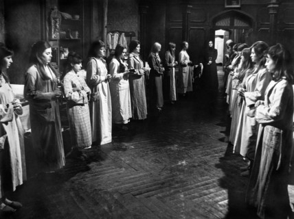 Candida Rosada (standing center between 2 rows of girls), on-set of the Spanish film, "The House
