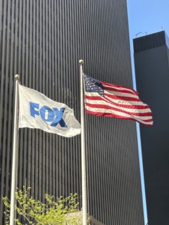 Fox News and American flags flying outside News Corp Building, Avenue of the Americas, New York