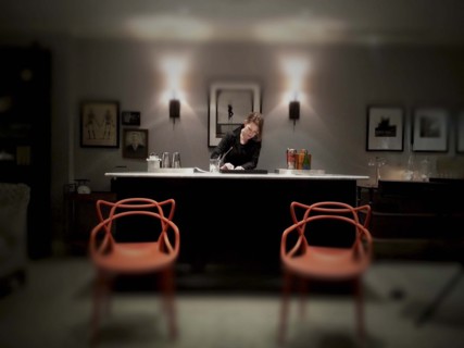 Mid-adult woman working at fancy cocktail bar
