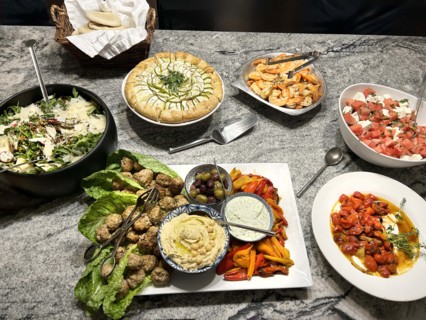 Arugula, farro and herb salad, roasted tomatoes with savory yogurt, feta salad, grilled shrimp and