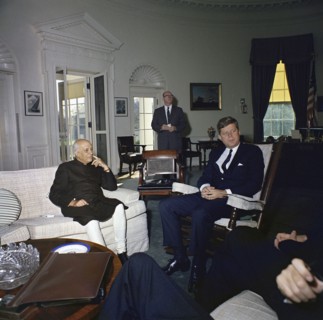 U.S. President John Kennedy (sitting in rocking chair) meeting with Prime Minister of India