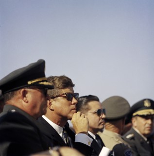 U.S. President John Kennedy sitting between General George H. Decker, Chief of Staff of U.S Army