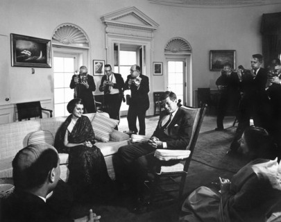 U.S. President John F. Kennedy (in rocking chair) meeting with Indira Gandhi, daughter of Prime
