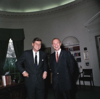 U.S. President John F. Kennedy standing with astronaut John H. Glenn, Jr., Oval Office, White