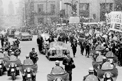 U.S. President John F. Kennedy and Mexican President Adolfo López Mateos waving to crowd from