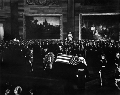 U.S. President Lyndon Johnson standing with bowed head at U.S. President John F. Kennedy's
