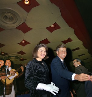 U.S. President John F. Kennedy and U.S. First Lady Jacqueline Kennedy greeting attendees at a