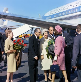 U.S. First Lady Jacqueline Kennedy  being greeted by (l-r): Elizabeth "Dearie" Cabell (with red