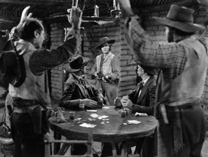 Jean Arthur (center with rifle), on-set of the western film, "Arizona", Columbia Pictures, 1940