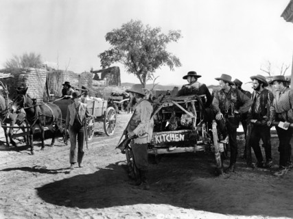 Jean Arthur (standing left with rifle), on-set of the western film, "Arizona", Columbia Pictures,