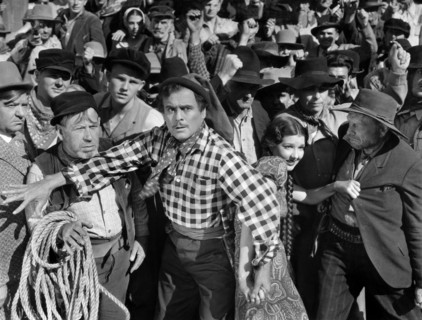 Leo Carrillo (foreground center), Jean Parker (right of Carrillo), on-set of the western film, "The