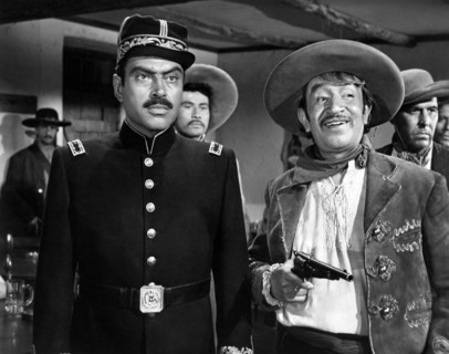Pedro Armendariz (left), Alfonso Bedoya (right), on-set of the western film, "Border River",