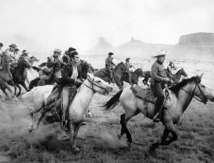 Stuart Whitman (foreground, left), Bruce Cabot (foreground, right), on-set of the western film,
