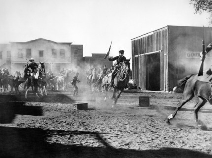 Bill Elliott (on horse, left), on-set of the western film, "Frontiers of '49", Columbia Pictures,