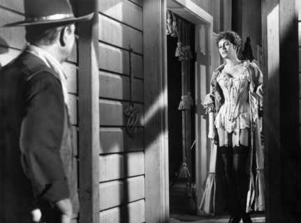 John Wayne, Charlene Holt, on-set of the western film, "El Dorado", Paramount Pictures, 1966